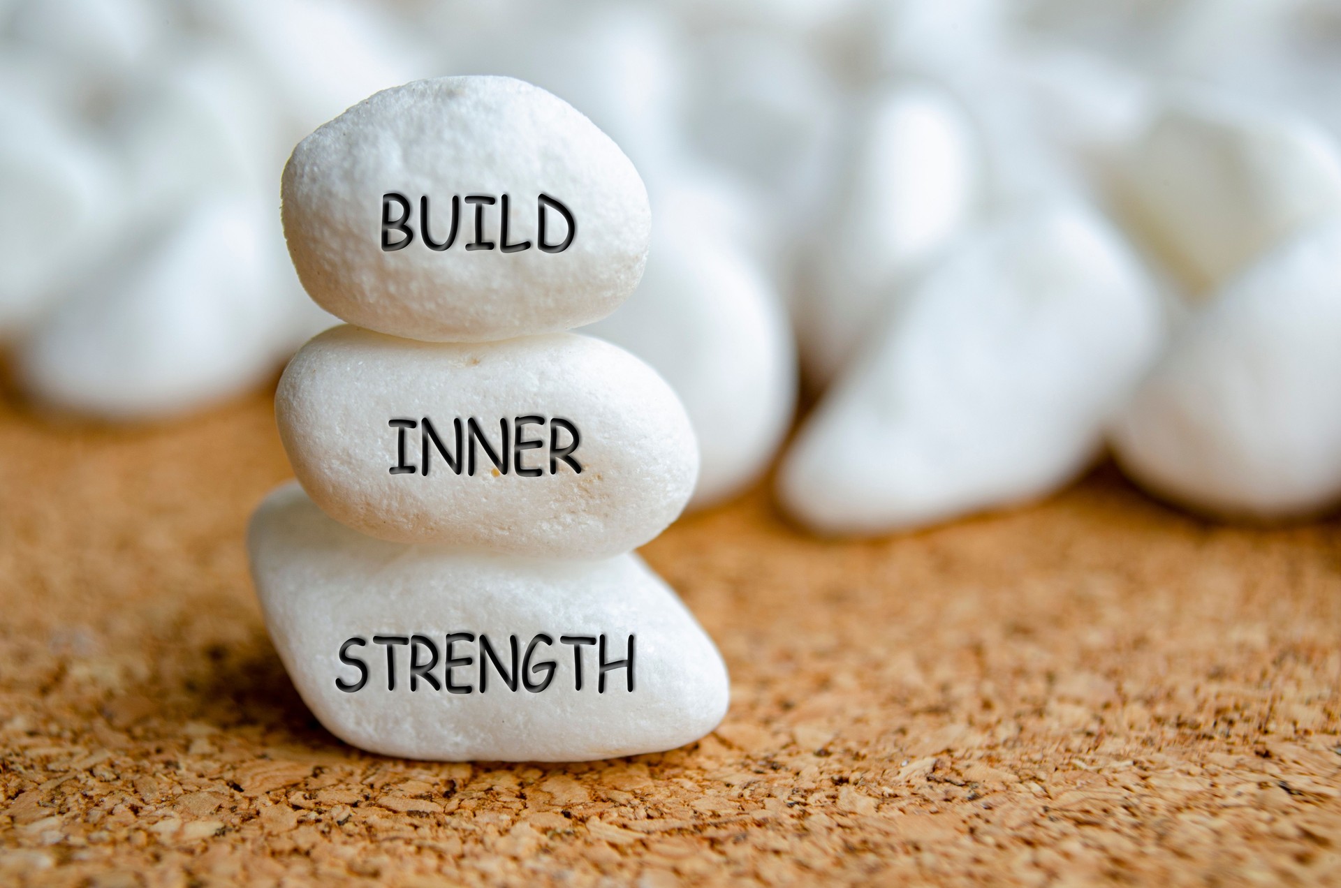 Build Inner Strength text on white stones. Inner strength concept